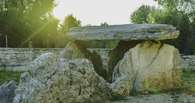 Time lapse sunset of the sun on the Dolmen della Chianca located in the municipality of Bisceglie, Apulia. Italy