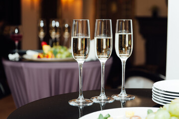 Glasses of champagne at the Banquet, white sparkling wine in wine glasses, festive mood