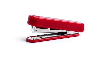 Red stapler on a white background. High quality photo