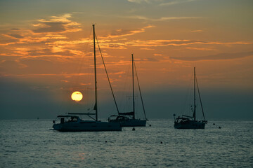 Beautiful evening Adriatic sea, yachts and full moon, Croatia.