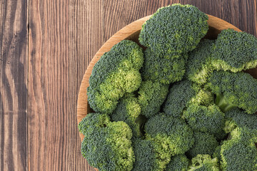  A lot of broccoli for diet and healthy eating. Fresh green broccoli on a   table.Broccoli vegetable is full of vitamin.Vegetables for diet and healthy eating.Organic food.