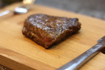 Fototapeta na wymiar grilled steak on a wooden board