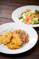 fried chicken breast with buckwheat and salad