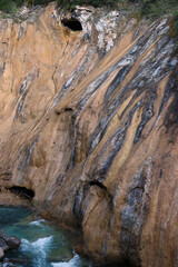 Portrait of Rock wall waterfall into Johnston creek