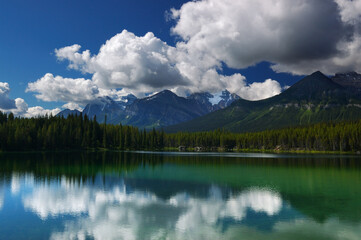 Fototapeta na wymiar Bow Range Peaks and clouds reflected in Herbert Lake