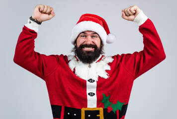 Fototapeta na wymiar happy bearded man in santa claus costume celebrate winter holiday of chistmas and feel merry about xmas gifts, happy new year