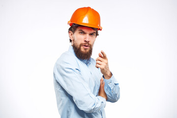 Engineers shirt orange hard hat construction lifestyle emotions cropped view light background
