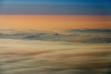 Fototapeta na wymiar Smokey Cloudy Airplane View