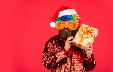 Cool Specials. Winter holidays. Bearded man celebrate christmas. Christmas entertainment ideas. Wishing you peace and prosperity. Christmas gift. Cheerful guy colorful hairstyle. Funny man with beard