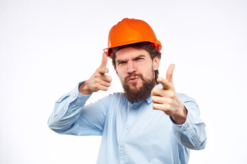 Emotional man in blue shirt orange helmet industry security Professional