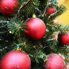 Christmas tree with new year decorations. New Year celebration. Selective soft focus. Background for postcards