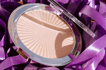 Beautiful highlighter for your face. Cosmetic macro. Macro photography of highlighter for makeup on...