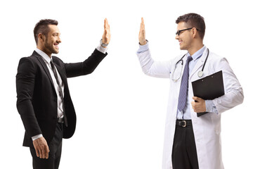 Male doctor making high-five gesture with a man in a suit