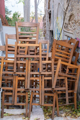 Fototapeta na wymiar Chairs stack, closed restaurant Covid-19 Pandemic lockdown