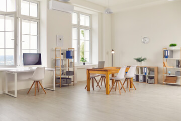 Interior of a new modern empty large business office, which is well lit by daylight.