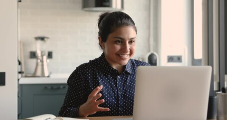 Emotional young indian ethnicity woman looking at laptop screen, reading email with unexpected amazing news, celebrating online lottery win, university admission notification or dream job offer.