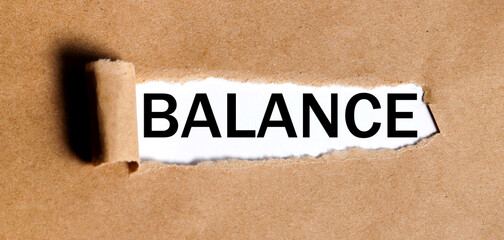 balance, text on white paper on torn paper background