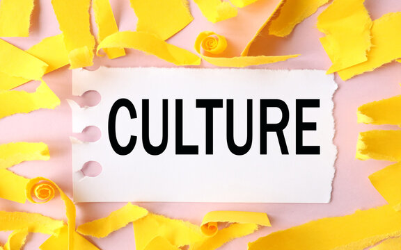culture, text on white paper on torn paper background