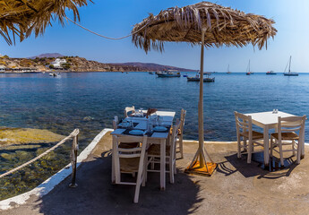 The view from a jetty of a water side cafe close to the Red Beach in Santorini in summertime