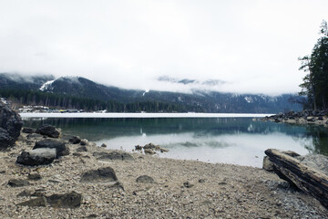 Elibsee lake with Zugspitze in clouds in winter