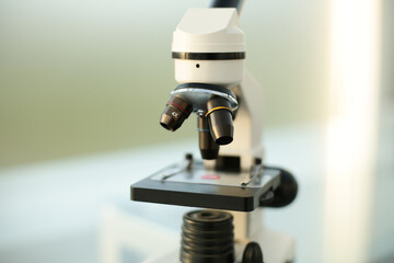 Medical microscope on glass table