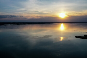 Obraz premium sunset on the lake and small island
