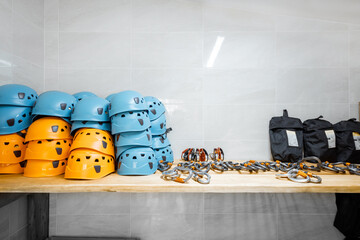 Hardhats and other safety equipment on the shelves at amusement park warehouse