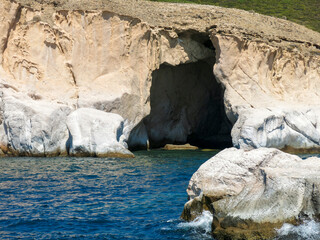 Entrance to the cave in sea in Izmir, Turkey. Rocky island. Danger in sea.