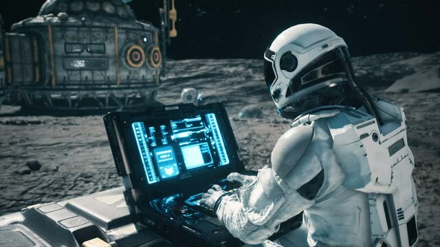 An astronaut works on his science laptop in a space colony on one of the planets. Looping Animation for fantasy, futuristic or space travel.