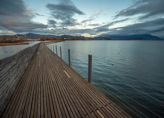 Stunning views of the historic wood bridge (Holzsteg) connecting the village of Hurden, Seedam, Schwyz with the city of Rapperswil, St. Gallen