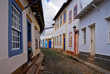 Fototapeta premium Typical street at historical city of Sao Joao del Rei, known as crooked houses street (a Rua das Casas Tortas)