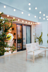 cozy rooftop patio with outdoor lights at rainy evening