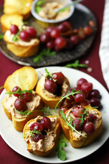 Selective focus. Macro. Canapes with pate and grapes. Healthy snack. Christmas food.