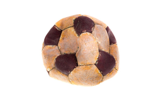 An old leather ball to play on the soccer field. Old accessories for athletes.