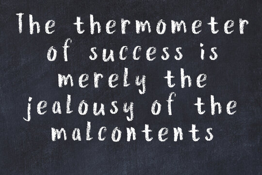 Black chalkboard with wise inscription on it