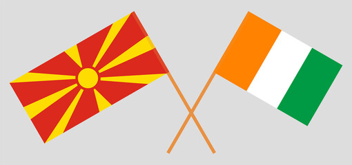 Crossed flags of North Macedonia and Republic of Ivory Coast