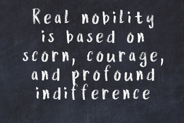 Chalk wise inscription on black chalkboard