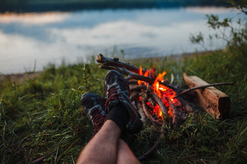 legs on the background of a campfire