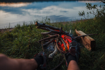 legs on the background of a campfire
