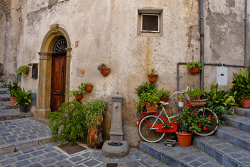 Fototapeta na wymiar A narrow street among the old houses of Lagonegro, an old city in the Basilicata region, Italy.