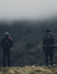People standing at edge of cliff