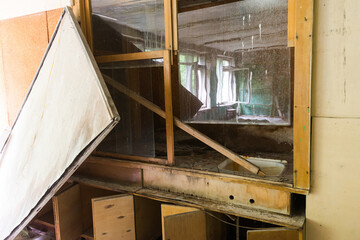 Broken furniture in abandoned school of soviet ghost town Chernobyl-2