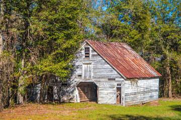 Fototapeta na wymiar Old wooden rustic style barn in rural Georgia front corner