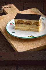 Banana cake in a nice plate on the wooden background