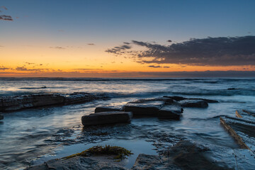 Rocky coastline sunrise seascape