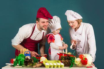 Family cooking at home. Cooking together. Family relationships. Healthy food at home. Healthy lifestyle. Advertising. Restaurant.