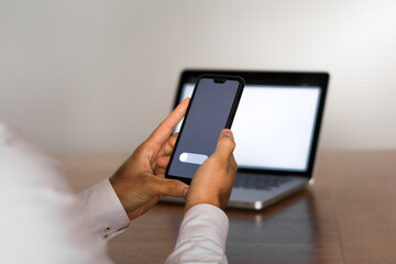 person using tablet computer and smart phone