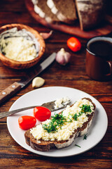 Toast with processed cheese, garlic and dill