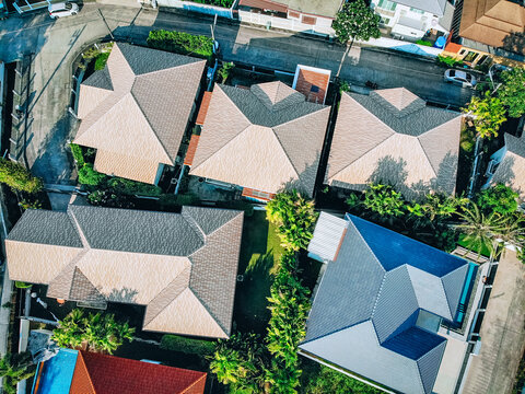 Top view of the roofs of buildings are ordinary green street on the outskirts of the city