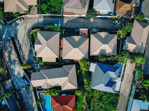 Aerial view of the roofs of buildings are ordinary green street on the outskirts of the city